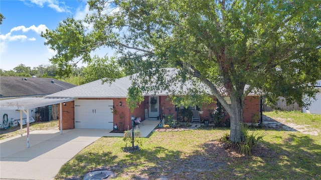 40 Westridge Rd, Davenport, FL 33837 - view of front facade with brick siding, an attached garage, and concrete driveway