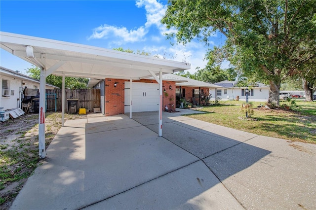 40 Westridge Rd, Davenport, FL 33837 - view of front of property with brick siding, driveway, a carport, and a garage