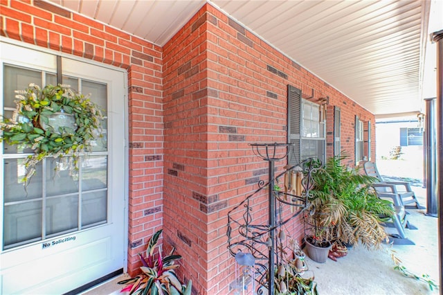 40 Westridge Rd, Davenport, FL 33837 - property entrance with brick siding and a porch