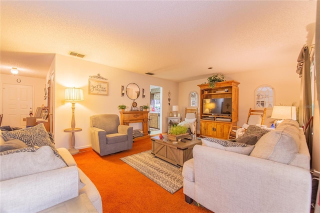 40 Westridge Rd, Davenport, FL 33837 - living room featuring a textured ceiling and carpet