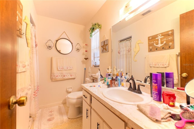 40 Westridge Rd, Davenport, FL 33837 - bathroom with toilet, vanity, and baseboards