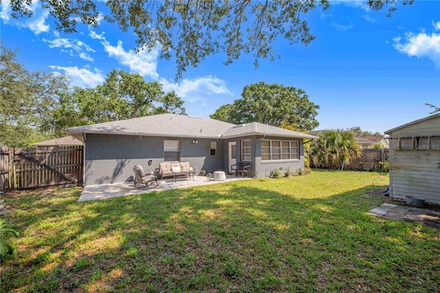 40 Westridge Rd, Davenport, FL 33837 - back of house featuring a patio, outdoor lounge area, and stucco siding