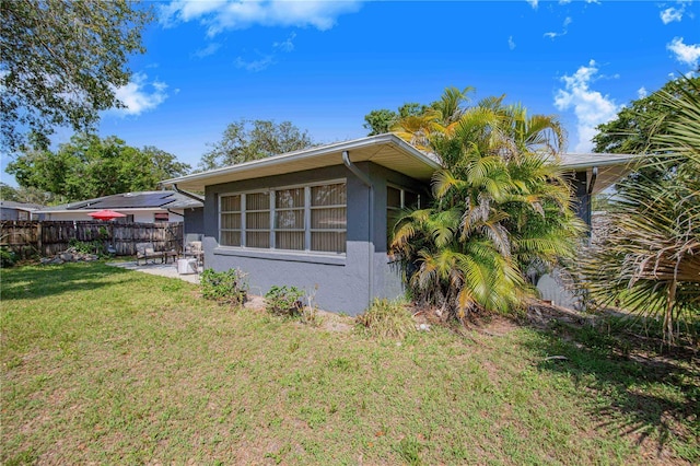 40 Westridge Rd, Davenport, FL 33837 - view of property exterior with stucco siding and a patio