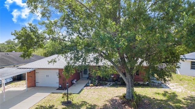 40 Westridge Rd, Davenport, FL 33837 - obstructed view of property featuring an attached garage, brick siding, driveway, roof with shingles, and a front yard