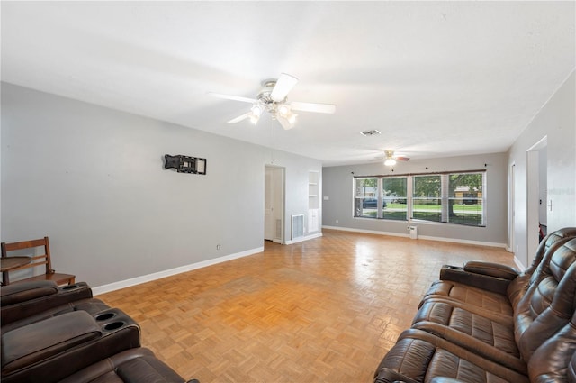961 Oleander Dr SE, Winter Haven, FL 33880 - living room with ceiling fan and baseboards