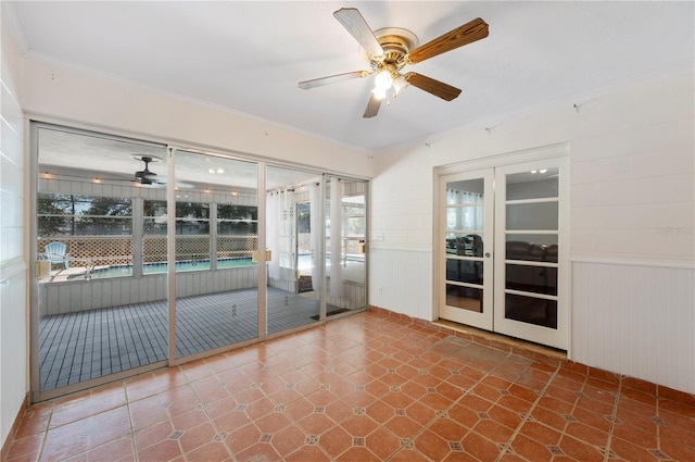 961 Oleander Dr SE, Winter Haven, FL 33880 - unfurnished sunroom featuring a ceiling fan and french doors