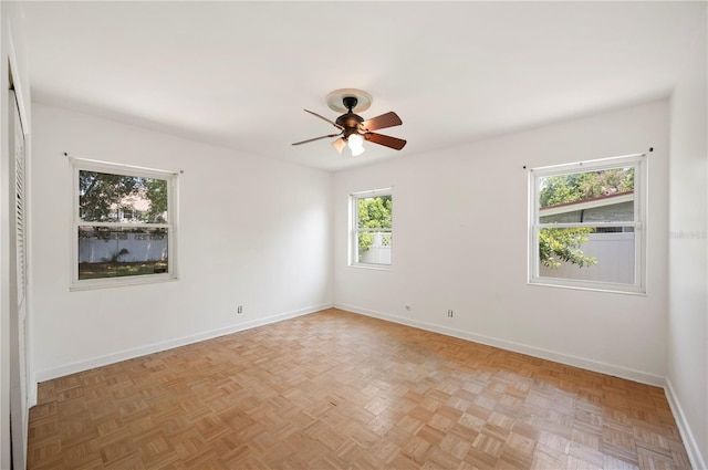 961 Oleander Dr SE, Winter Haven, FL 33880 - empty room featuring baseboards and a ceiling fan