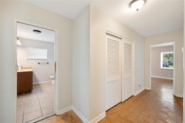961 Oleander Dr SE, Winter Haven, FL 33880 - corridor with baseboards and a sink