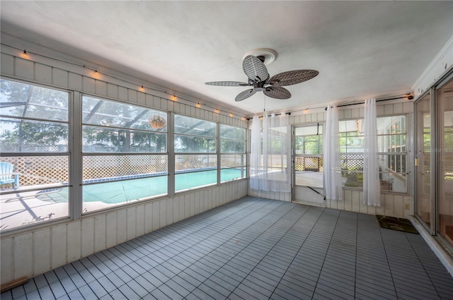 961 Oleander Dr SE, Winter Haven, FL 33880 - unfurnished sunroom featuring a ceiling fan and healthy amount of natural light