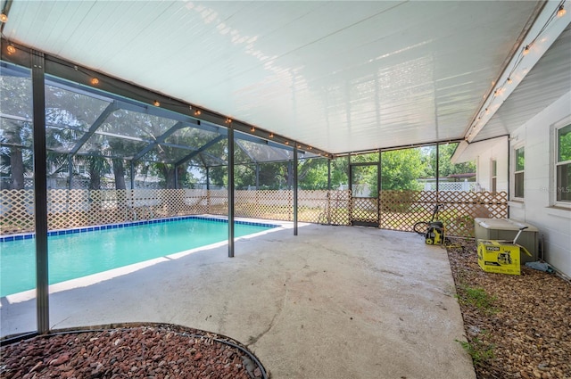 961 Oleander Dr SE, Winter Haven, FL 33880 - view of swimming pool featuring a patio area and glass enclosure