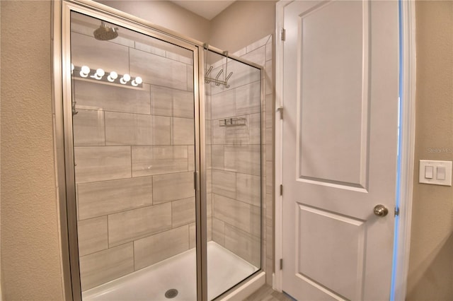 1100 Sugarwood St, Davenport, FL 33837 - full bath with a stall shower and a textured wall