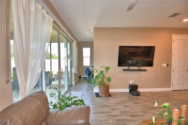 1100 Sugarwood St, Davenport, FL 33837 - living room featuring baseboards, recessed lighting, wood finished floors, and a ceiling fan
