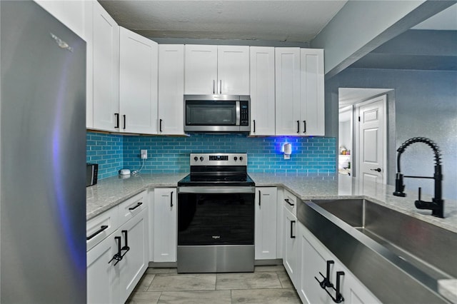 1140 W Seminole Trl, Bartow, FL 33830 - kitchen with stainless steel appliances, a sink, decorative backsplash, and light stone countertops