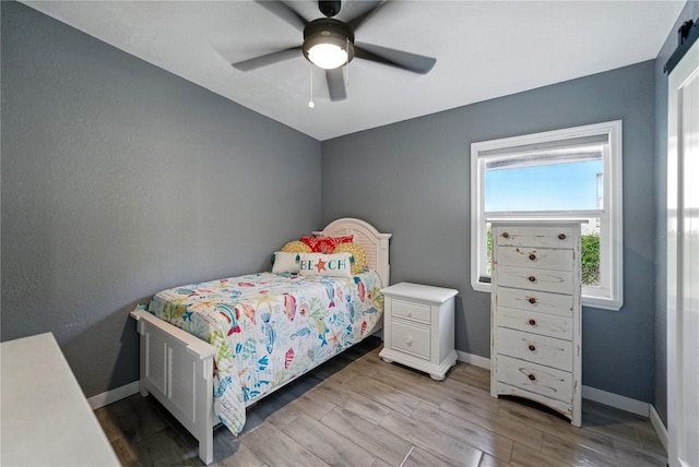 1140 W Seminole Trl, Bartow, FL 33830 - bedroom featuring baseboards, wood finished floors, and ceiling fan
