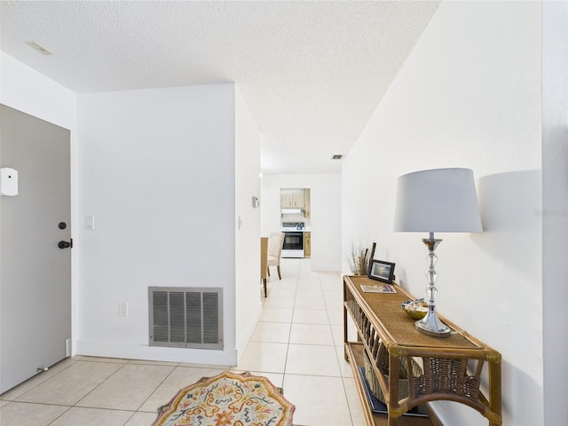 2700 Bayshore Blvd Unit 3210, Dunedin, FL 34698 - corridor with light tile patterned flooring and a textured ceiling