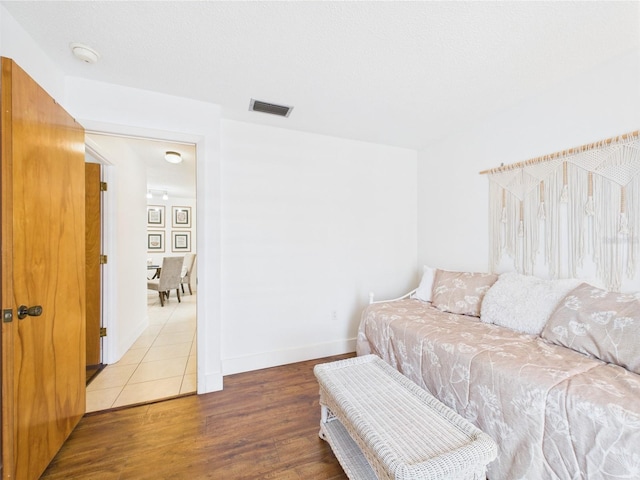 2700 Bayshore Blvd Unit 3210, Dunedin, FL 34698 - bedroom featuring wood finished floors and baseboards