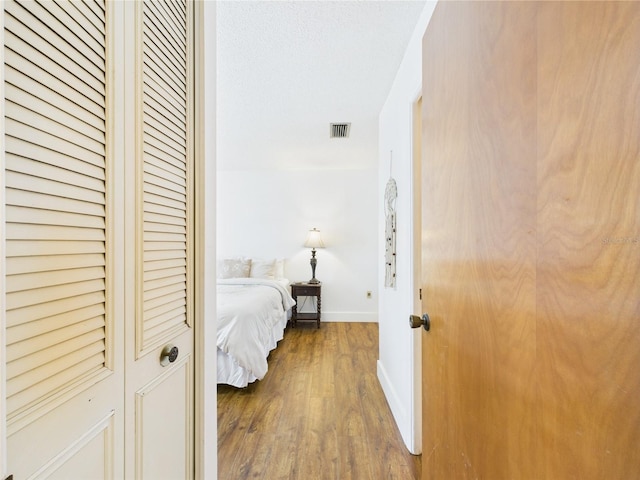 2700 Bayshore Blvd Unit 3210, Dunedin, FL 34698 - bedroom featuring wood finished floors and baseboards
