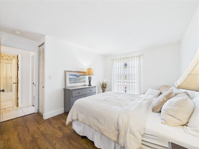 2700 Bayshore Blvd Unit 3210, Dunedin, FL 34698 - bedroom with wood finished floors, baseboards, and a closet