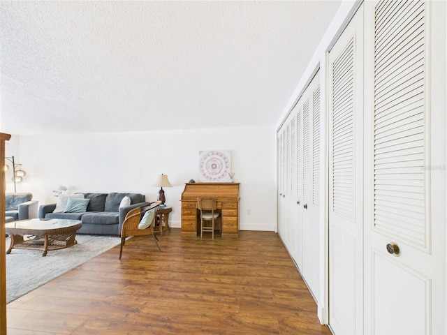 2700 Bayshore Blvd Unit 3210, Dunedin, FL 34698 - living room featuring a textured ceiling and wood finished floors