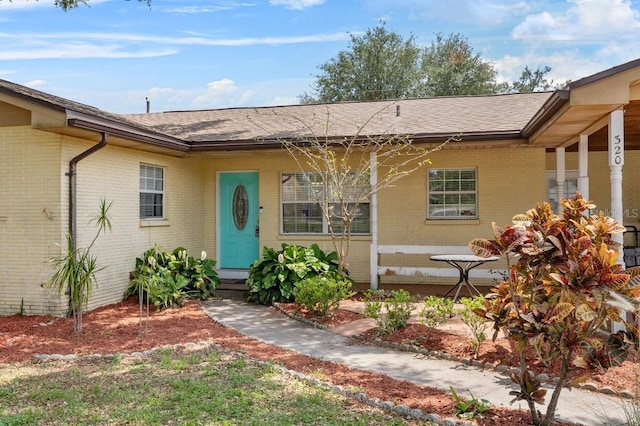 320 Boger Blvd S, Lakeland, FL 33803 - view of front of home with brick siding and a shingled roof