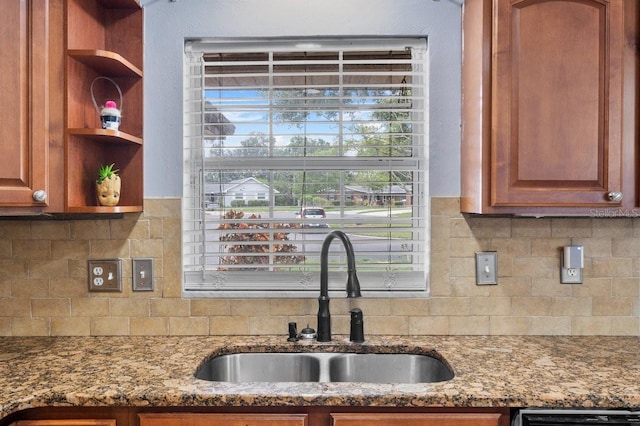 320 Boger Blvd S, Lakeland, FL 33803 - kitchen featuring a sink, open shelves, stone countertops, and backsplash