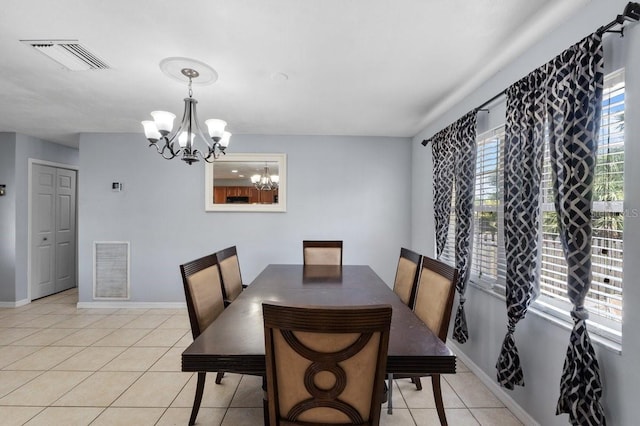 320 Boger Blvd S, Lakeland, FL 33803 - dining area with a chandelier, light tile patterned floors, and baseboards