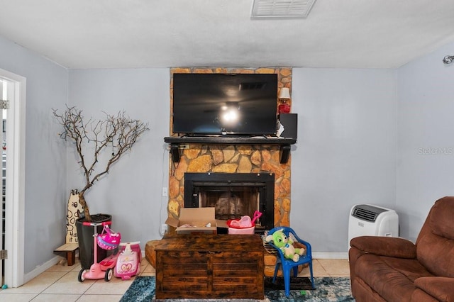 320 Boger Blvd S, Lakeland, FL 33803 - living area featuring tile patterned flooring, baseboards, and a fireplace