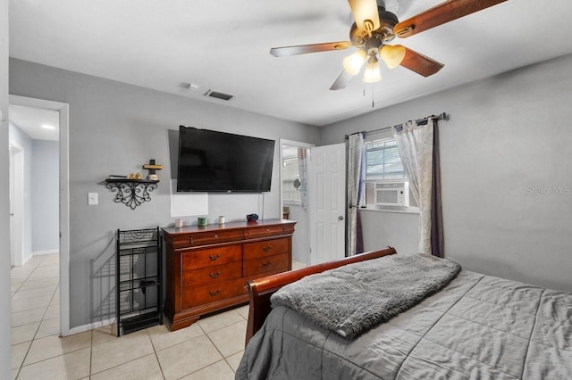 320 Boger Blvd S, Lakeland, FL 33803 - bedroom featuring light tile patterned floors, cooling unit, a ceiling fan, and baseboards