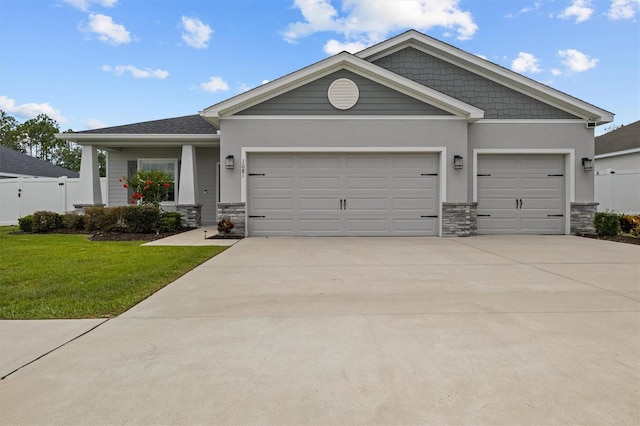 1081 Sandpiper Loop, Winter Haven, FL 33881 - craftsman-style home with a garage, stone siding, and concrete driveway