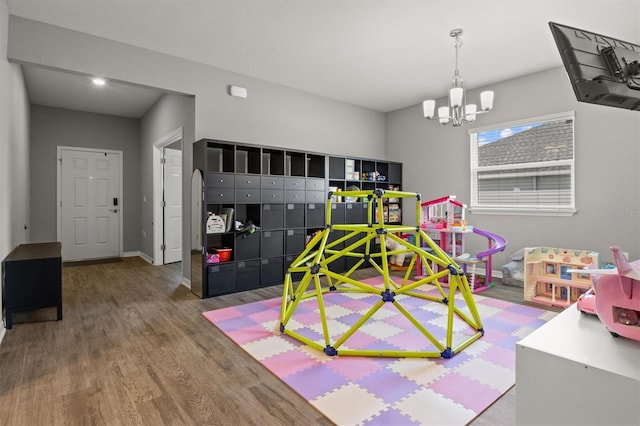 1081 Sandpiper Loop, Winter Haven, FL 33881 - rec room featuring wood finished floors, a chandelier, and baseboards
