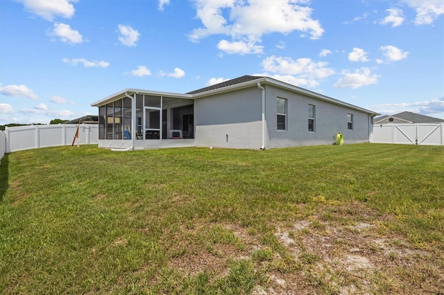 1081 Sandpiper Loop, Winter Haven, FL 33881 - rear view of property with a sunroom and stucco siding