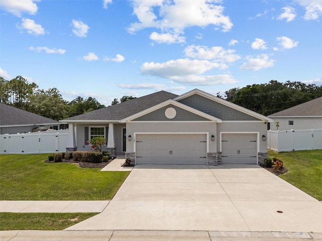 1081 Sandpiper Loop, Winter Haven, FL 33881 - craftsman-style house featuring a gate, an attached garage, driveway, stone siding, and stucco siding