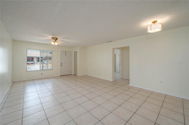 299 Winter Ridge Blvd Unit 299, Winter Haven, FL 33881 - unfurnished room featuring a textured ceiling, ceiling fan, light tile patterned floors, and baseboards