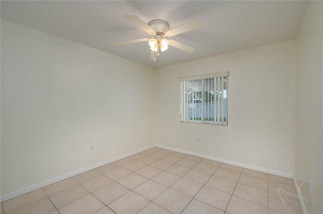 299 Winter Ridge Blvd Unit 299, Winter Haven, FL 33881 - spare room featuring a ceiling fan, a textured ceiling, baseboards, and light tile patterned flooring