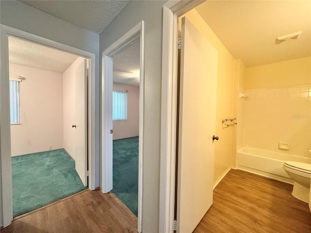 254 Winter Ridge Blvd Unit 254, Winter Haven, FL 33881 - hall with wood finished floors and a textured ceiling