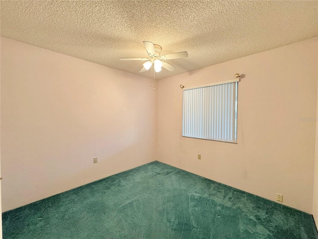 254 Winter Ridge Blvd Unit 254, Winter Haven, FL 33881 - unfurnished room featuring dark carpet, a ceiling fan, and a textured ceiling
