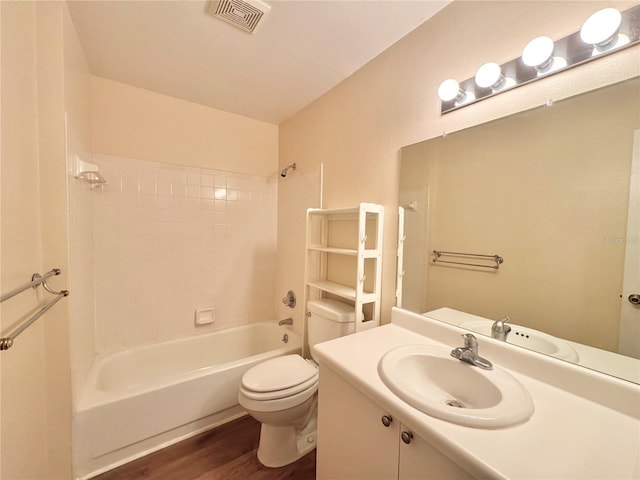 254 Winter Ridge Blvd Unit 254, Winter Haven, FL 33881 - bathroom with wood finished floors, toilet, vanity, and tub / shower combination