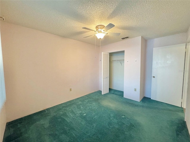 254 Winter Ridge Blvd Unit 254, Winter Haven, FL 33881 - unfurnished bedroom with carpet, a closet, ceiling fan, and a textured ceiling