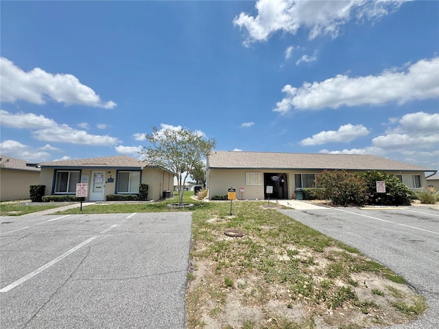 254 Winter Ridge Blvd Unit 254, Winter Haven, FL 33881 - single story home featuring uncovered parking and stucco siding