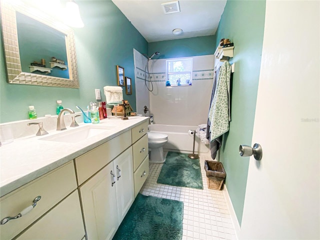 2213 W Pilaklakaha Ave, Auburndale, FL 33823 - full bathroom with vanity, toilet, bathing tub / shower combination, tile patterned flooring, and baseboards