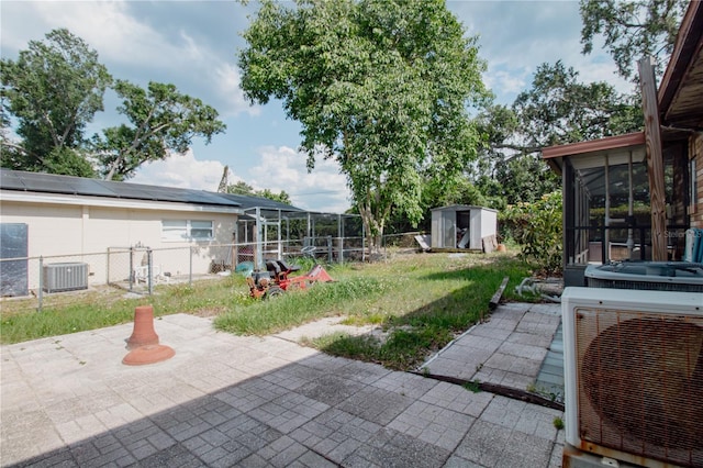 2213 W Pilaklakaha Ave, Auburndale, FL 33823 - view of yard with a sunroom, central AC unit, a patio, and ac unit