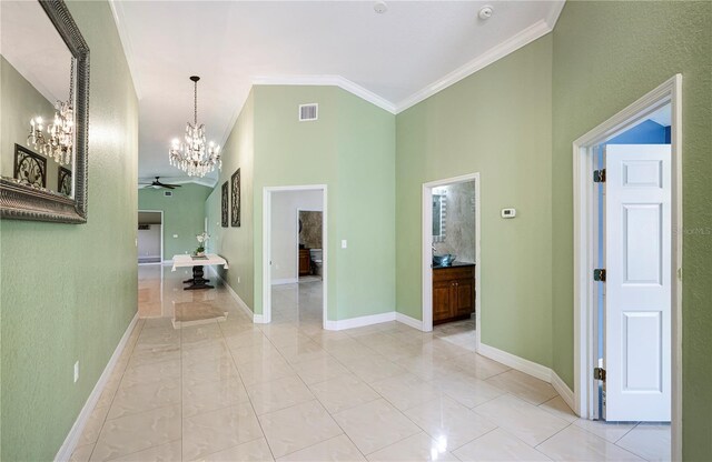 1553 Wright Dr, Lakeland, FL 33805 - hallway featuring a chandelier, crown molding, baseboards, and a high ceiling