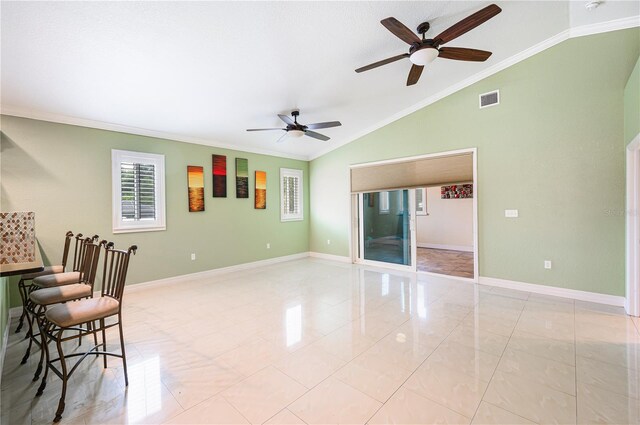 1553 Wright Dr, Lakeland, FL 33805 - unfurnished room with lofted ceiling, a ceiling fan, crown molding, and baseboards