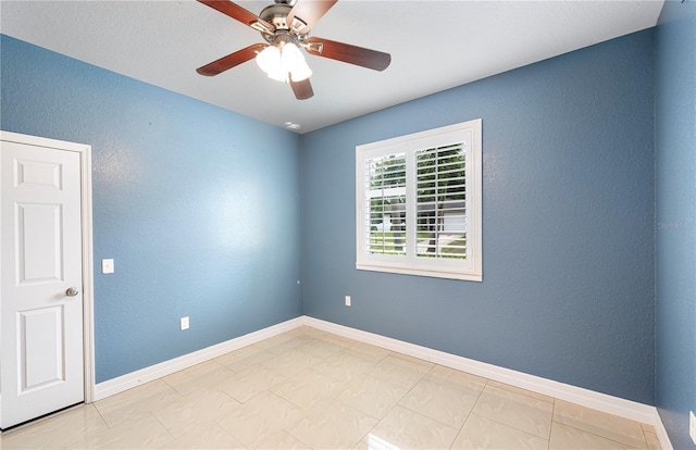 1553 Wright Dr, Lakeland, FL 33805 - unfurnished room with ceiling fan, a textured wall, and baseboards