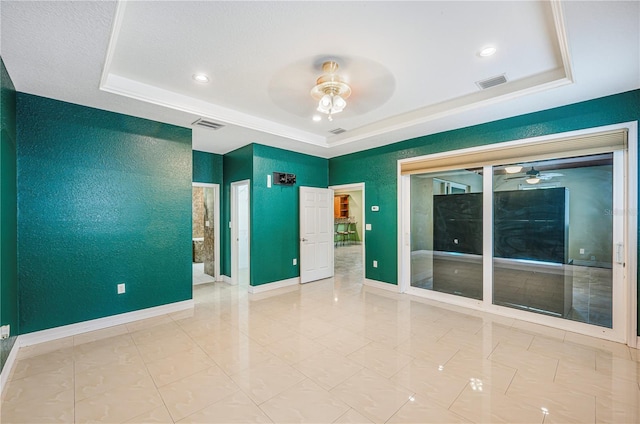 1553 Wright Dr, Lakeland, FL 33805 - empty room with a ceiling fan, a raised ceiling, baseboards, and recessed lighting
