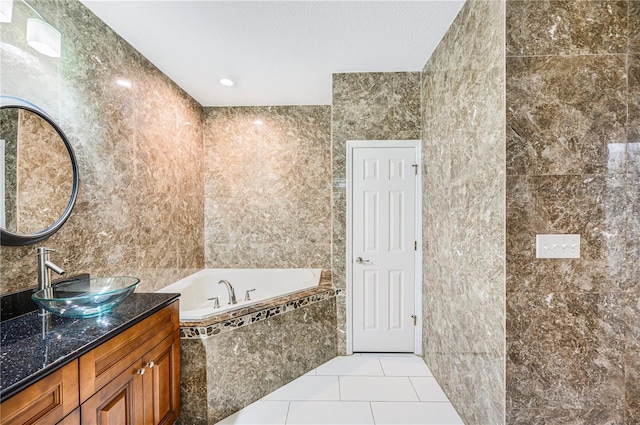 1553 Wright Dr, Lakeland, FL 33805 - full bathroom with vanity, tile walls, a garden tub, and tile patterned floors