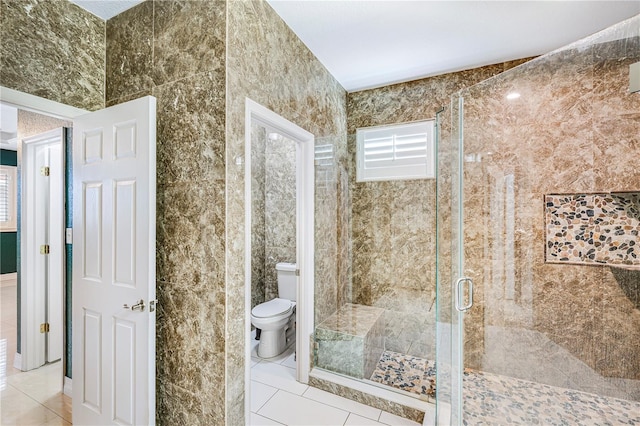 1553 Wright Dr, Lakeland, FL 33805 - bathroom with tile patterned floors, a stall shower, and toilet