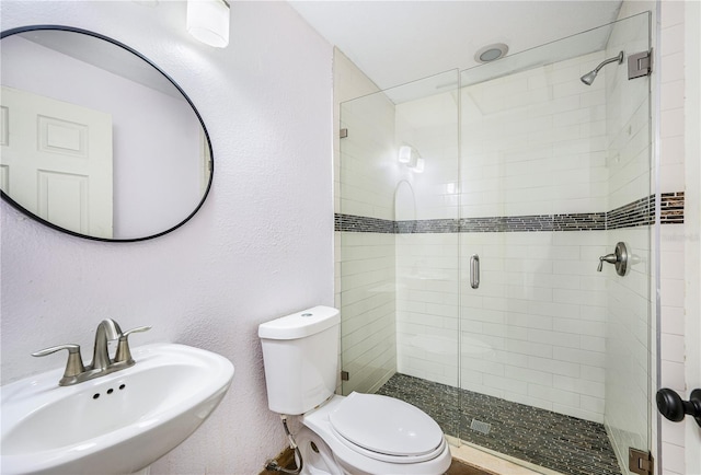 1553 Wright Dr, Lakeland, FL 33805 - bathroom featuring a sink, toilet, and a shower stall