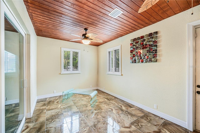 1553 Wright Dr, Lakeland, FL 33805 - unfurnished room with wood ceiling, ceiling fan, and baseboards