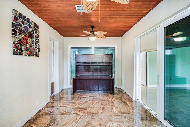 1553 Wright Dr, Lakeland, FL 33805 - corridor featuring wood ceiling, marble finish floors, and baseboards